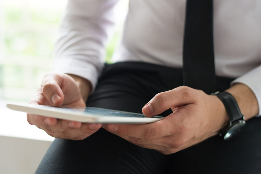 Distributor Ban Gajah Tunggal Terpercaya 2 Man Using Mobile Computer
